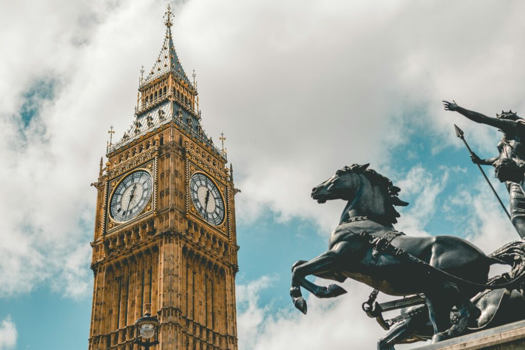 big ben and a statue in front. showcasing one of many photo spots in london.